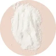 A small pile of fine white powder on a beige surface.